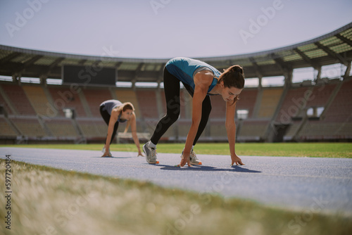 Two girls waiting for the whistle to start running