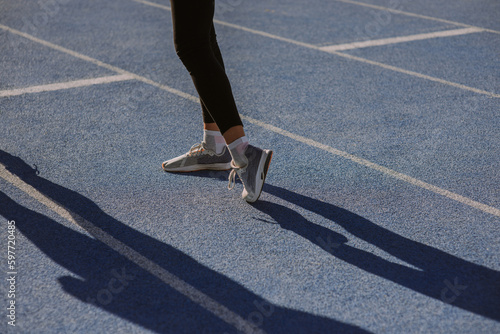 A girl is exercising her leg's wrist