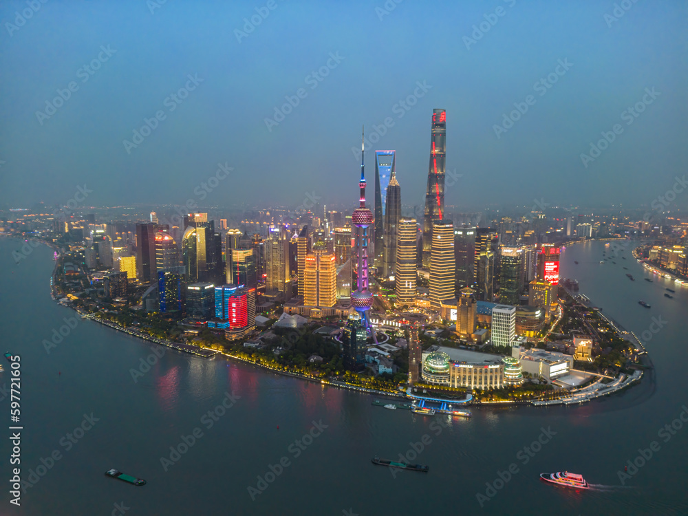 The drone aerial view of Lujiazui, Pudong, Shanghai at night time.   Lujiazui is the largest financial zone in mainland China.	