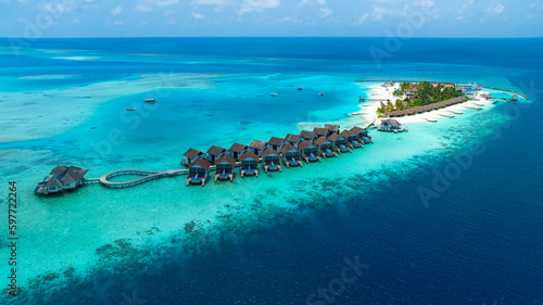 The Tropical aerial view with maldives paradise scenery seascape with water villas as amazing sea and lagoon beach, Exotic tourism
