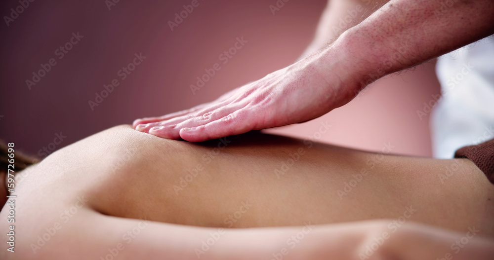 Naklejka premium Woman Receiving Back Massage From Therapist