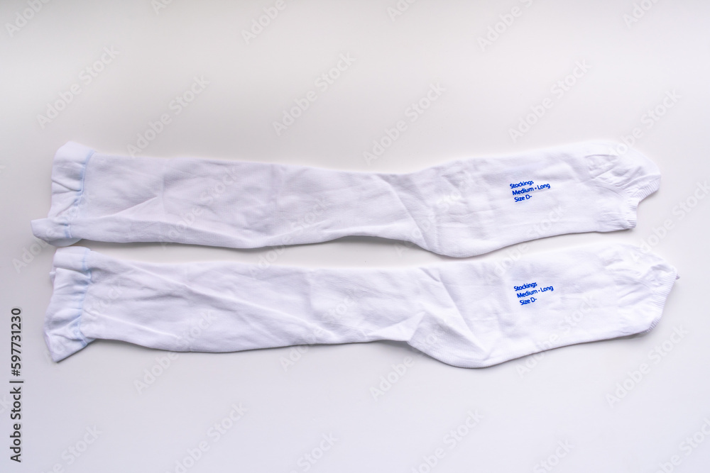 A pair of compression stockings isolated in white for hospital patients