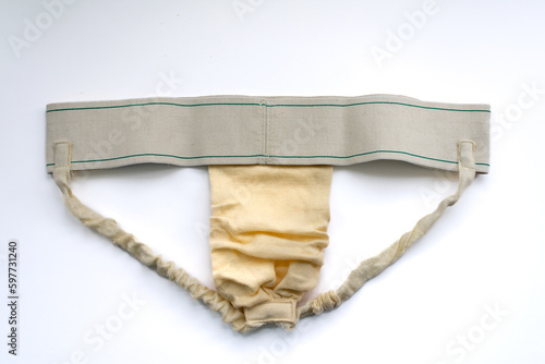 A jock strap isolated in white for post hernia surgery support of the groin and penis. Also as genital protective sports gear.