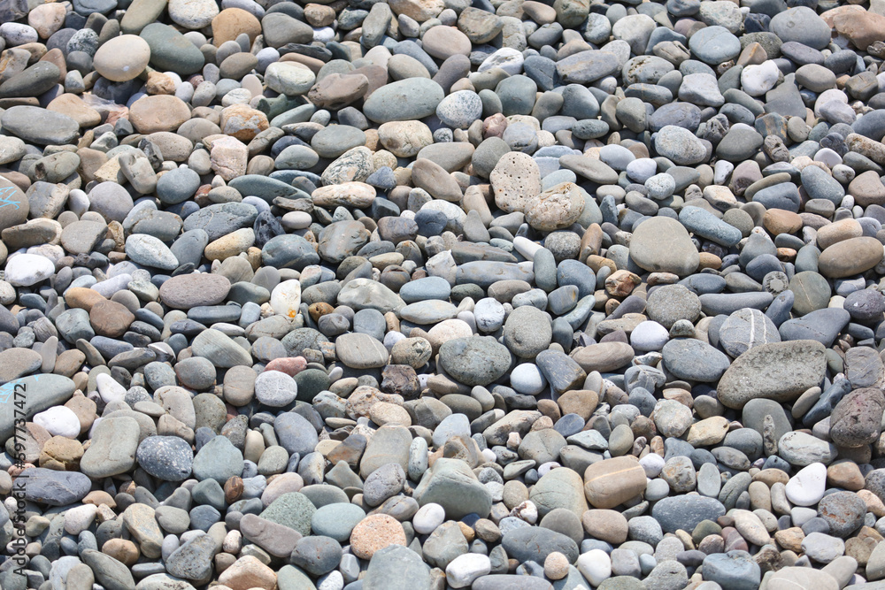 Stone pebbles as an abstract background. Texture. Stone pebbles as an abstract background. Texture.