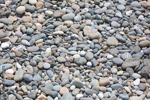 Stone pebbles as an abstract background. Texture.