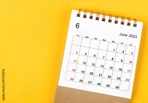 A June 2023 Monthly desk calendar for 2023 year on yellow background.