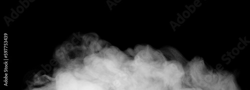 Fragments of abstract white smoke isolated on black background. steam cloud close up photo