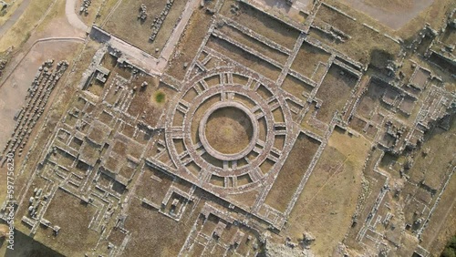 4K Aerial Drone Rise and Rotate over Ancient Circular Ruins at Sacsayhuaman in Cusco, Peru. Other ruins visible on edges