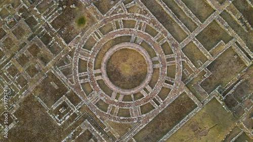 4K Aerial Drone Rise and Rotate over Ancient Incan Circular Ruins at Sacsayhuaman in Cusco, Peru. Other ruins visible.