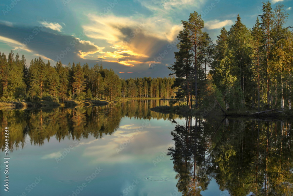 Bright summer sunset over the lake in the woods, Sweden around town Dorotea