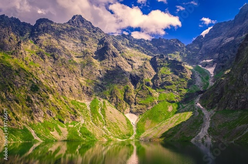 Beautiful lake in polish mountains in summer scenery.  Black Pond is one the most popular place in High Tatra Mountains  Poland.