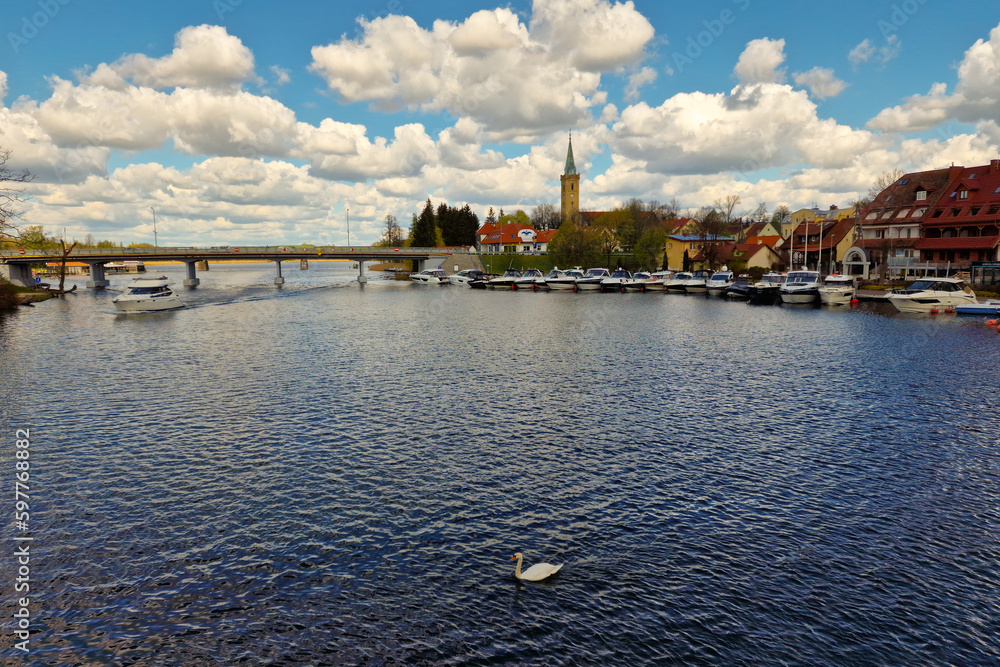 Fototapeta premium panoramic view of embankment in Mikolajki resort town, Warmia Masuria Province. Mikolajki, Poland