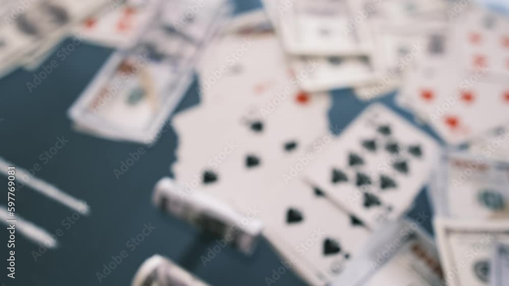Blured video of Rolled 100 us dollars, 2 lines of cocaine, illegal drugs on a black glass table. Drug addiction. Blured video of Rolled 100 us dollars, 2 lines of cocaine, illegal drugs on a black glass table. Drug addiction.