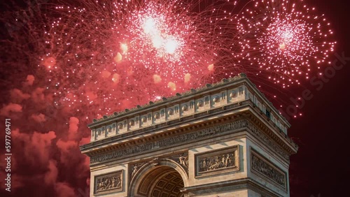 Celebratory fireworks over the Arc de Triomphe ( 4K, time lapse), Paris, France. The walls of the arch are engraved with the names of 128 battles and names of 660 French military leaders (in French)  photo