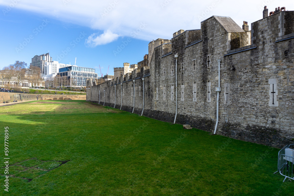 Interior of the Tower of London, with the courtyards and the central building, on a sunny day.