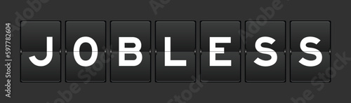 Black color analog flip board with word jobless on gray background