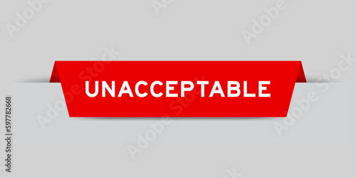 Red color inserted label with word unacceptable on gray background