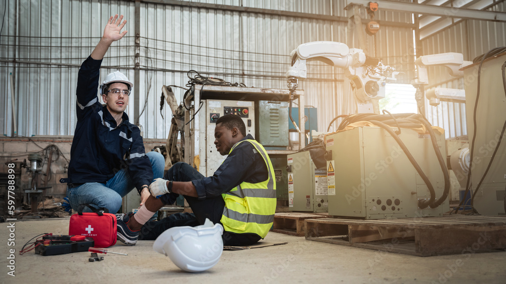 Fototapeta premium Engineers has an accident while working in a industrial manufacturing robot arms factory.