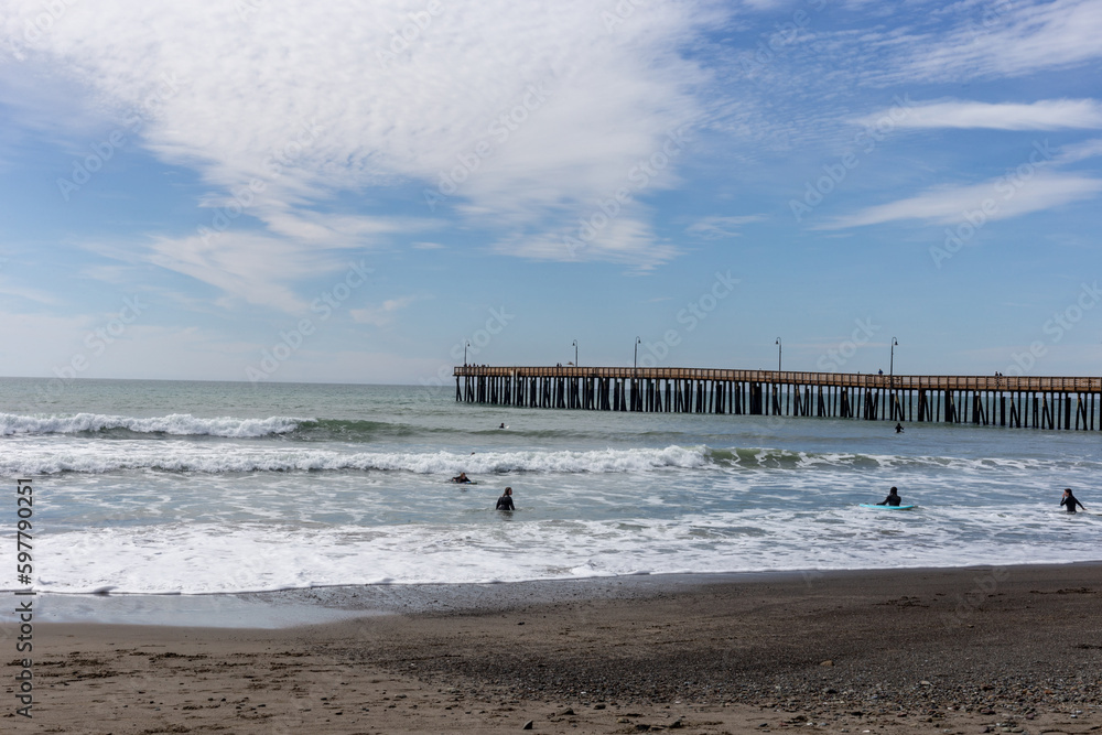 A view on the pier on the Pacific coast at sunset