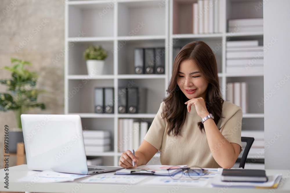 Portrait of smiling beautiful business asian woman working in office use computer with copy space. Business owner people sme freelance online marketing e-commerce telemarketing, work from home concept Portrait of smiling beautiful business asian woman working in office use computer with copy space. Business owner people sme freelance online marketing e-commerce telemarketing, work from home concept