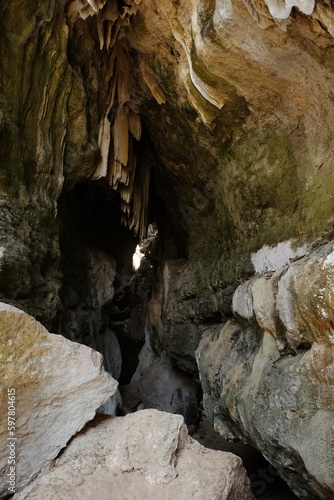 The atmosphere at Batu Cermin  one of the tourist destinations in Labuan Bajo  East Nusa Tenggara  Indonesia. There are caves with stalagmites and stalactites and arid conditions around them.