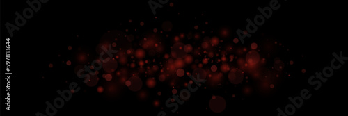 Bokeh particles, abstract background with shiny dust on black background.