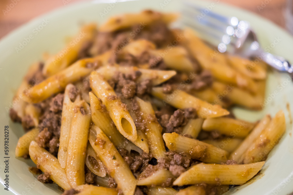 Penne Pasta with Meat Sauce served on plate Penne Pasta with Meat Sauce served on plate