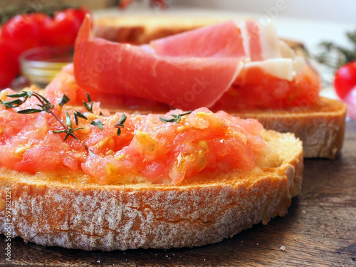 Toasted bread rubbed with fresh garlic and ripe tomato, then drizzled with olive oil photo