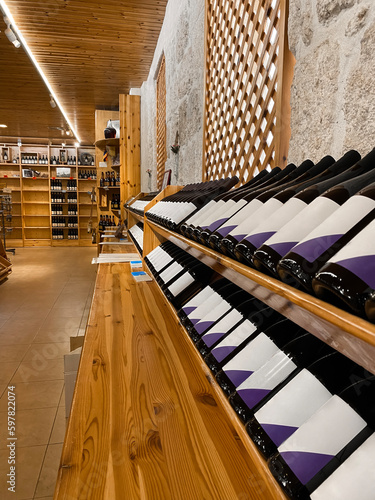 Fotografie, Obraz Wooden storage stand with bottles of wine in store