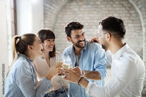 Photography Group of happy business people toasting with wine at office party