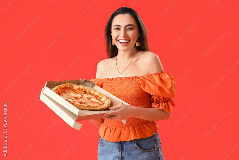 Beautiful woman with box of tasty pizza on red background Beautiful woman with box of tasty pizza on red background