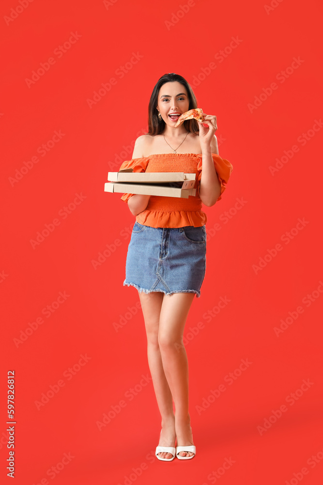 Beautiful woman with box of tasty pizza on red background Beautiful woman with box of tasty pizza on red background