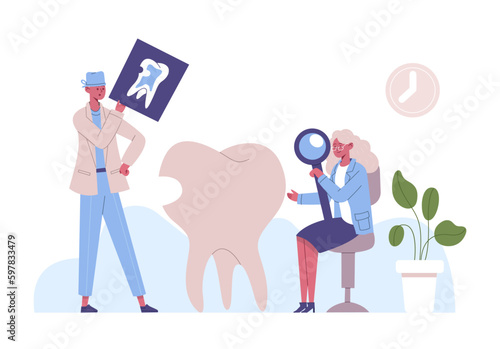 Dental clinic treatment. Woman examining tooth with cavity holding magnifying glass. Dentist looking at x-ray picture