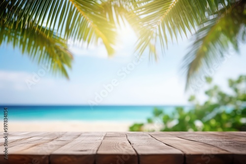 Wooden table top on blur tropical beach background - can be used for display or montage your products.