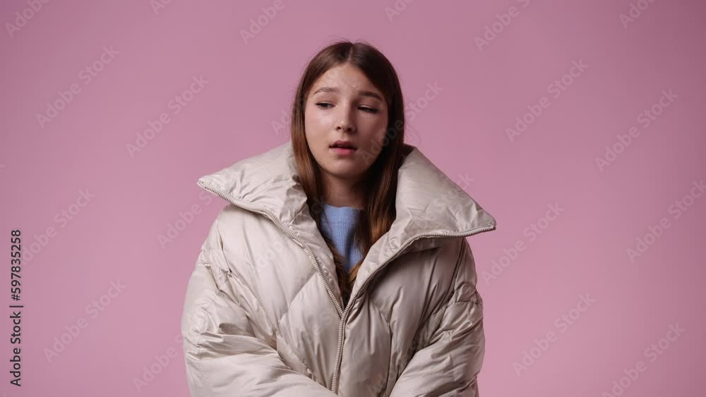 4k video of one girl posing for a video on pink background. 4k video of one girl posing for a video on pink background.