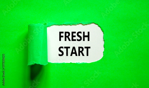 Fresh start and motivational symbol. Concept words Fresh start on beautiful white paper. Beautiful green table green background. Business motivational and Fresh start concept. Copy space.