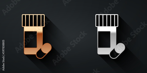 Gold and silver Medicine bottle and pills icon isolated on black background. Bottle pill sign. Pharmacy design. Long shadow style. Vector