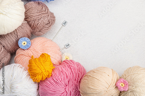 A set of colorful clew of thread for knitting and special craft tools. Handmade, hobby concept