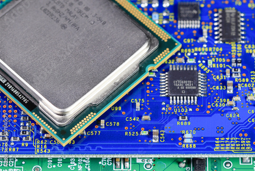 Obraz na płótnie Close up of High performance CPU or central processor unit on electronic board background.