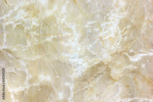 Natural raw yellow marble floor backdrop.