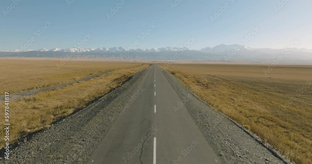 Empty endless road asphalt straight freeway through arid flat steppe with mountains backgorund. Aerial top down view, Highway trip without cars at summer sunny day
Empty endless road asphalt straight freeway through arid flat steppe with mountains backgorund. Aerial top down view, Highway trip without cars at summer sunny day
