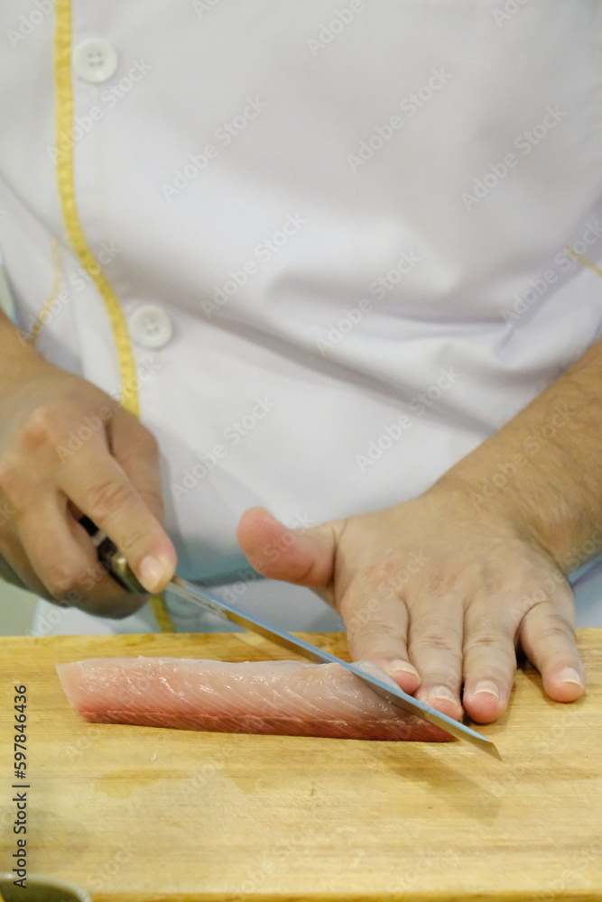 chef cutting meat