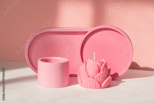 Home decor pink plates and a handmade lotus candle.