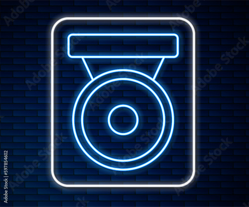 Glowing neon line Boxing gong icon isolated on brick wall background. Boxing bell. Vector