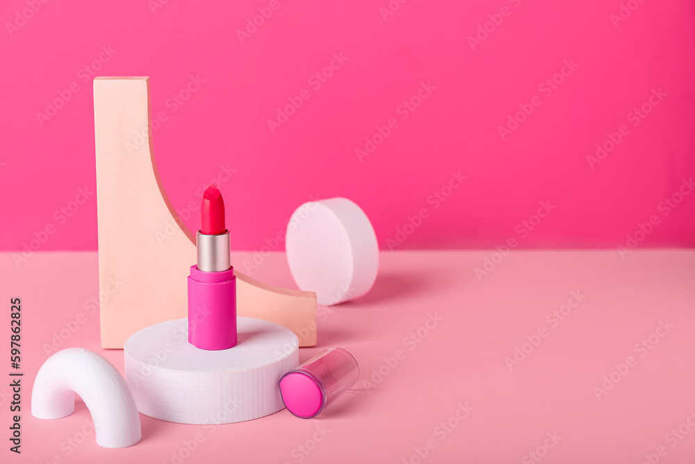 Decorative plaster podiums and lipstick on pink background Decorative plaster podiums and lipstick on pink background