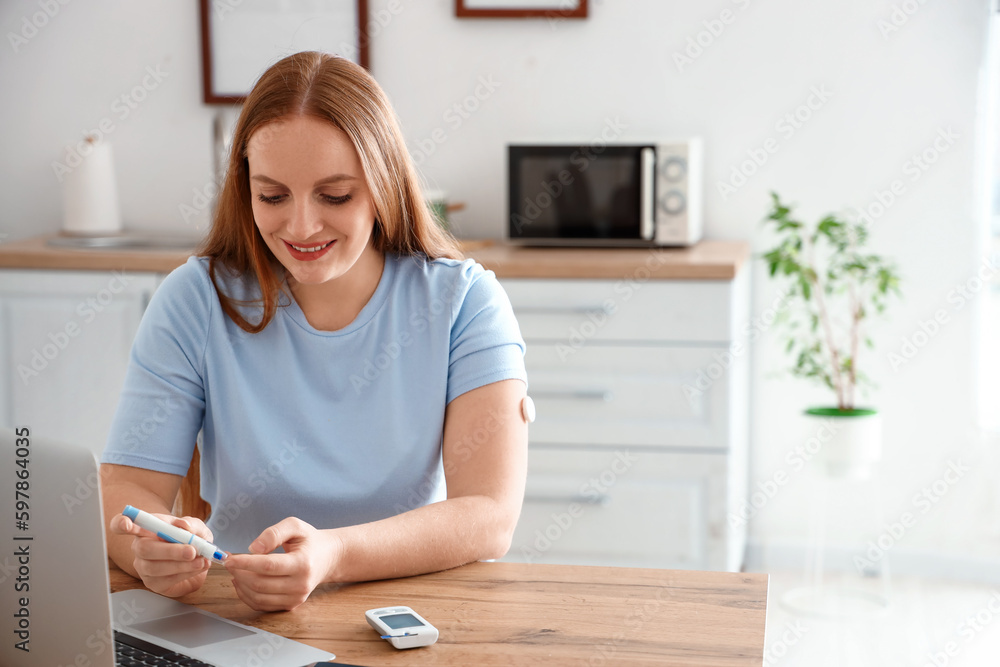 Woman with diabetes measuring blood sugar level at home Woman with diabetes measuring blood sugar level at home