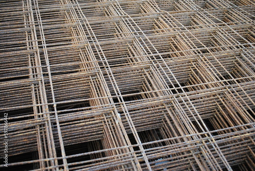 Stack of metal grates for housing foundation concrete pour close up abstract building materials