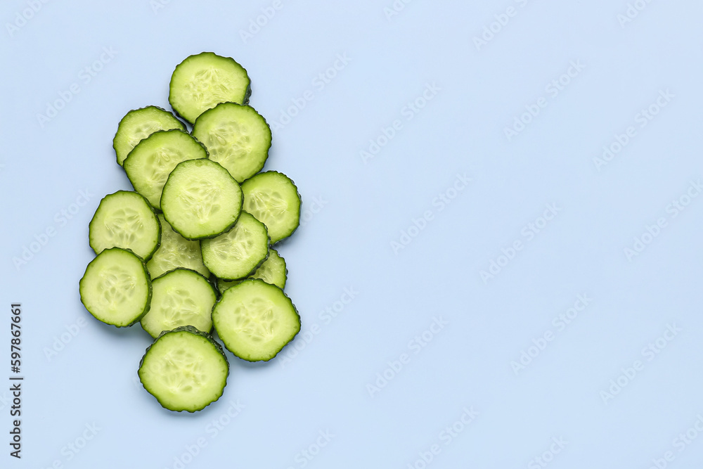 Slices of cucumber on blue background Slices of cucumber on blue background
