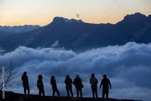 silhouettes of people against the background of mountains