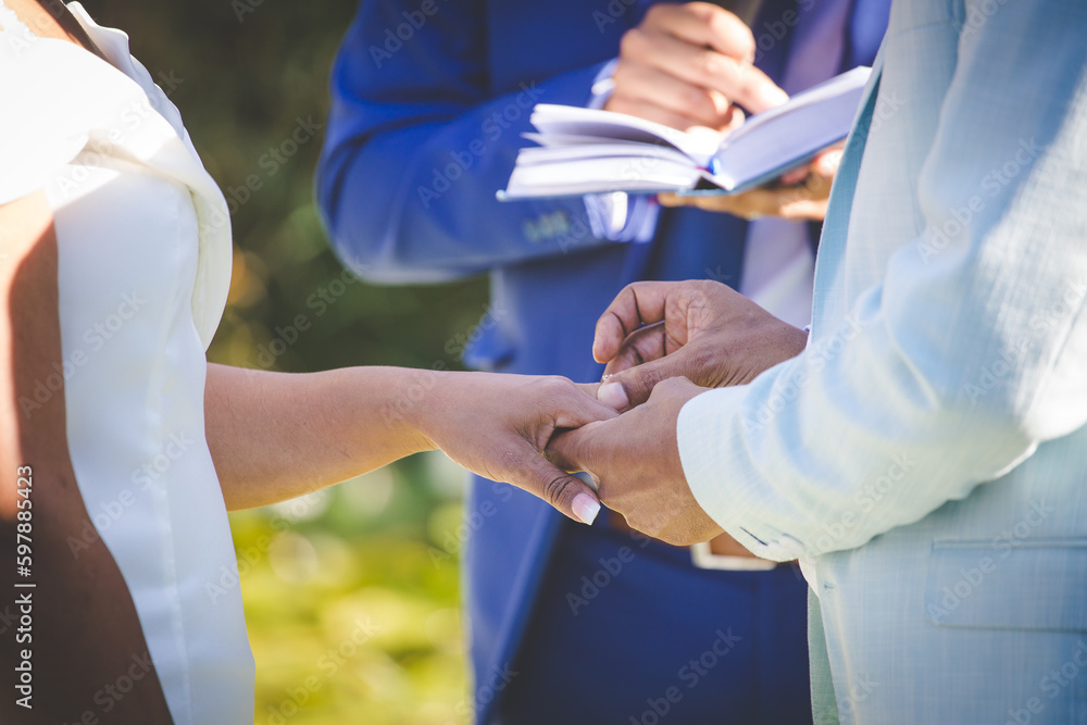 Intimate Moment of a couple Exchanging Wedding Rings at a wedding Intimate Moment of a couple Exchanging Wedding Rings at a wedding